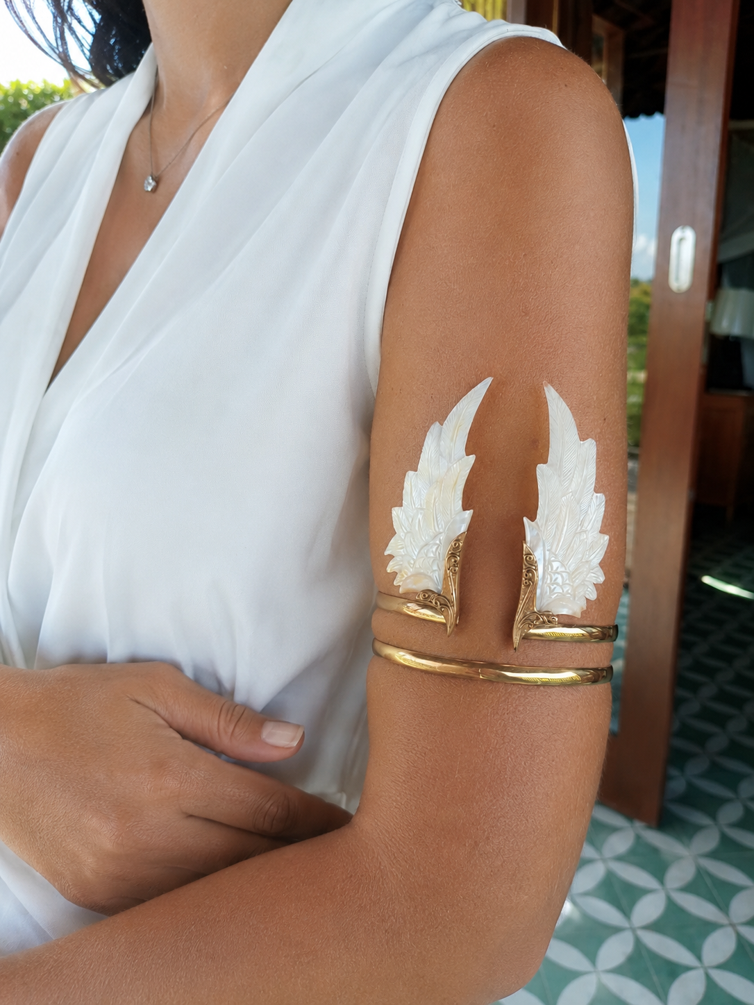 Celeste Wings brass arm cuff with carved Mother of Pearl wings