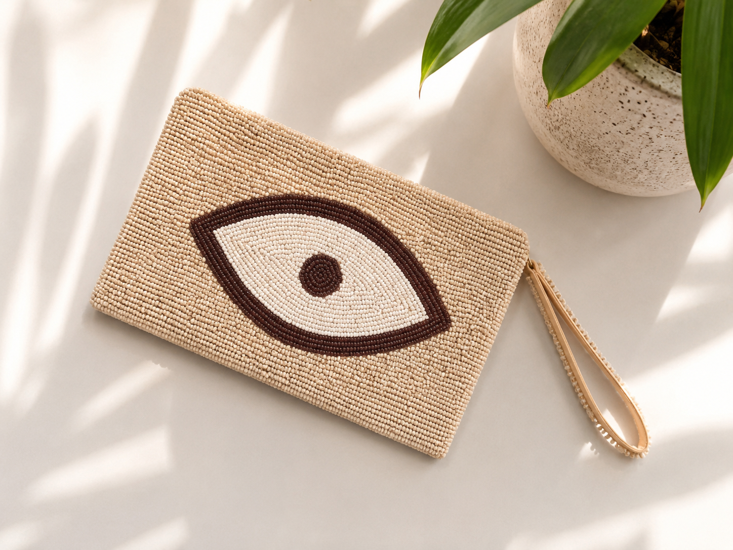 Sahara Eye beige hand-beaded clutch with ivory and brown Evil Eye motif