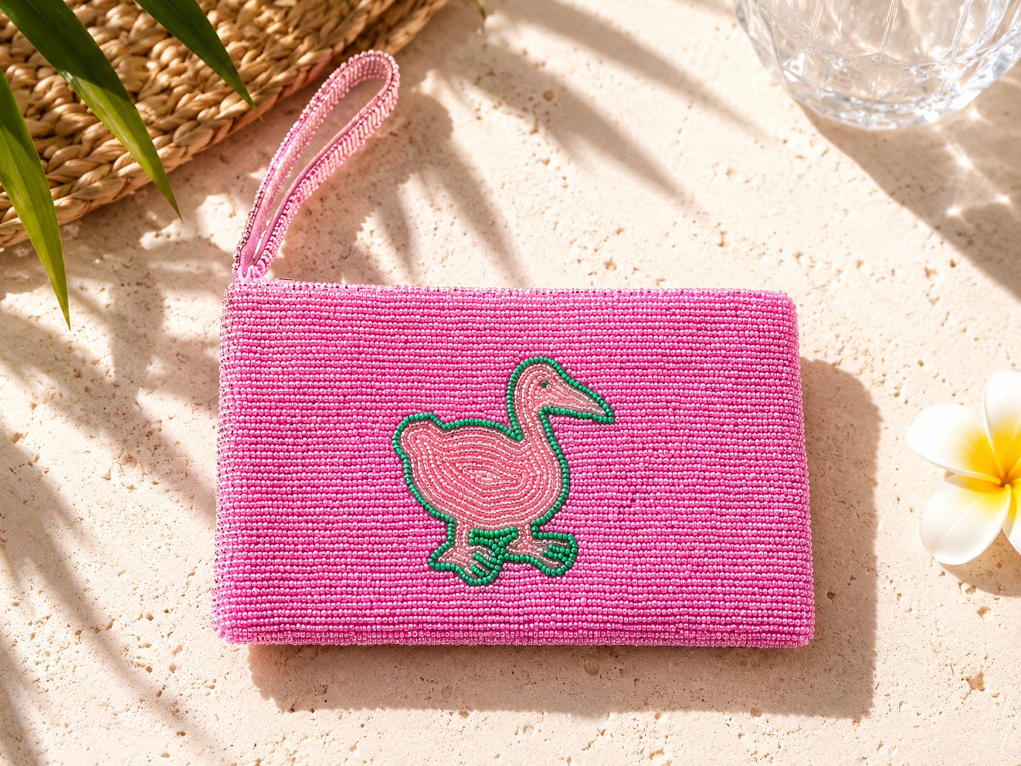 Pink Goose vibrant pink hand-beaded clutch with blush pink and green bird motif