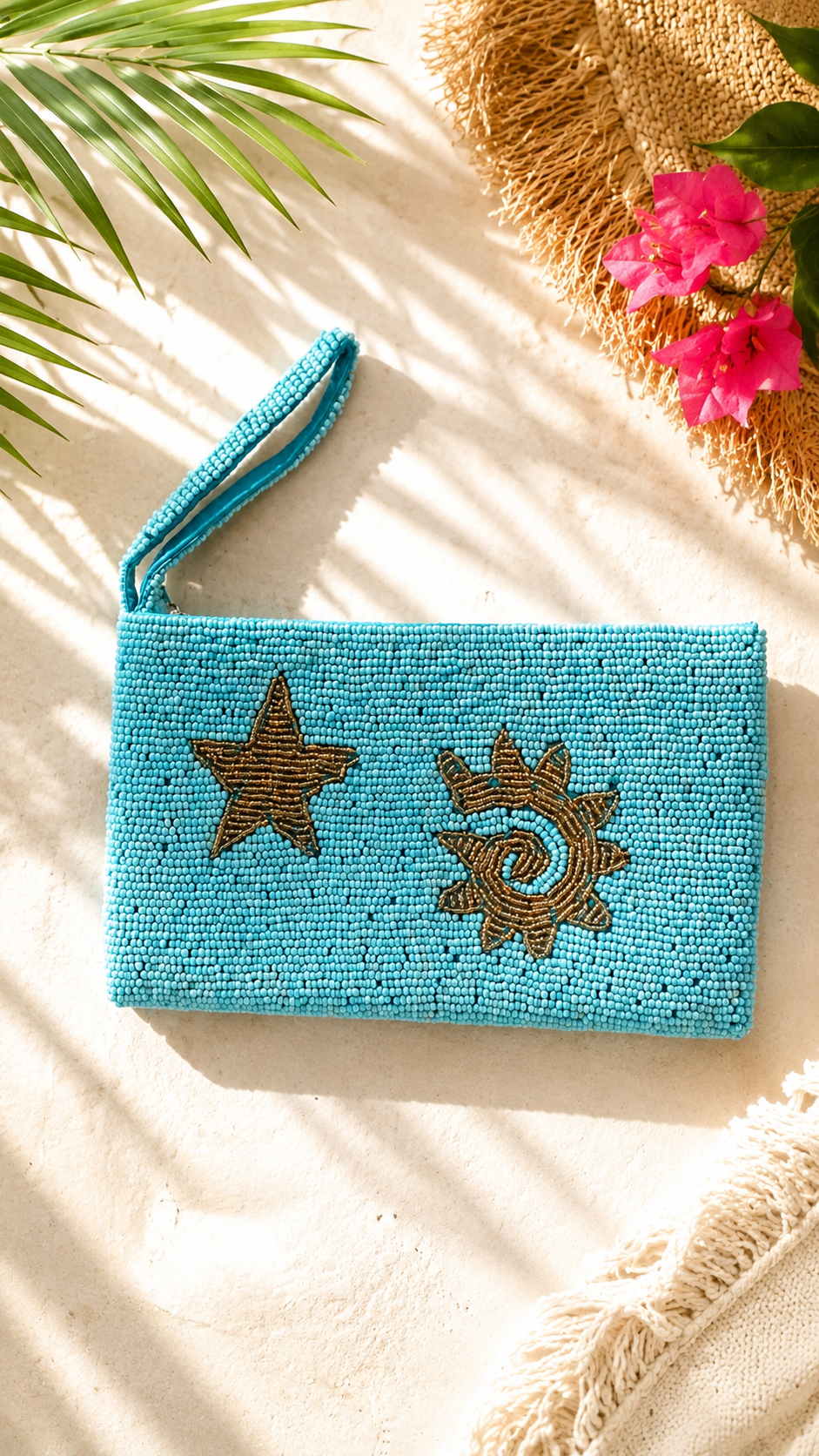 Solara turquoise hand-beaded clutch with golden sun and star motifs