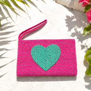Amora pink hand-beaded clutch with large turquoise heart motif