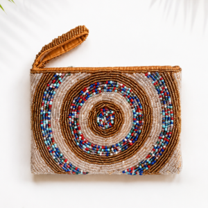 Nomad Spiral mini hand-beaded pouch with bronze ivory and multicolour spiral motif