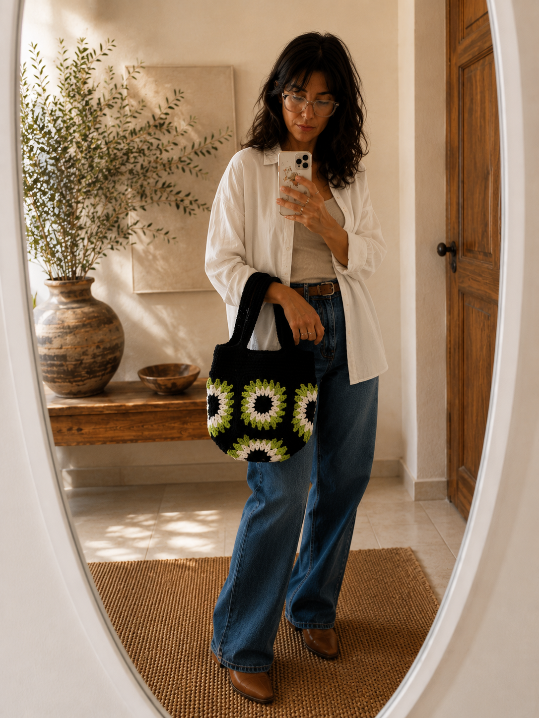 Neroli handmade black crochet tote bag with ivory and green floral motifs