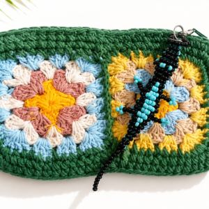 Laguna handmade green crochet clutch with colourful granny squares and turquoise beaded gecko charm