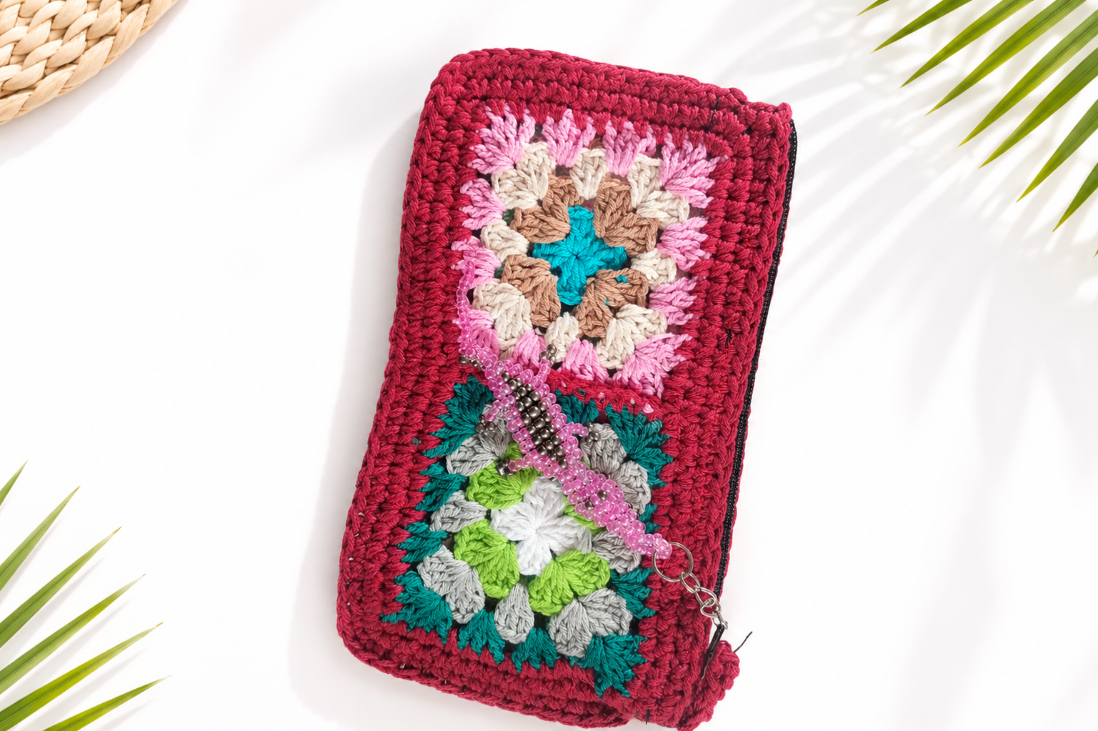 Zinnia dark red handmade crochet clutch with colourful granny squares and pink beaded lizard