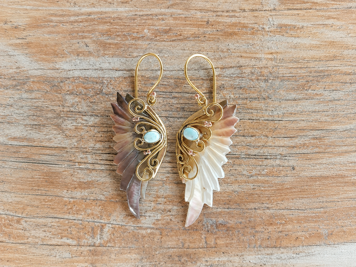 Aurelia Wings brass earrings with carved Mother of Pearl wings and turquoise stones