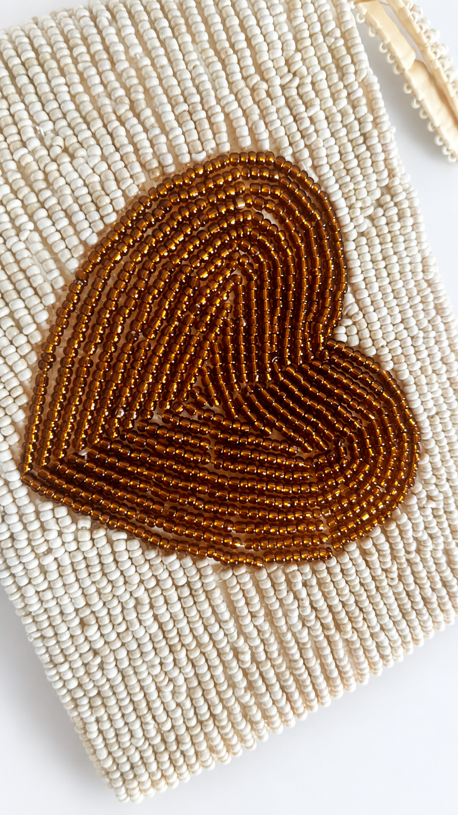 Amora mini ivory beaded pouch with bronze brown heart motif